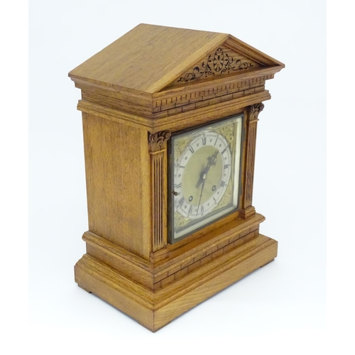 1434 - A 19thC German oak cased mantle clock by Winterhalder & Hofmeier, having a silvered chapter ring, th... 