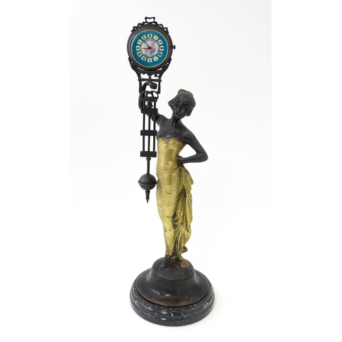 1443 - A Continental Art Nouveau style mystery clock (swing clock), with figural detail. Approx. 11 1/2