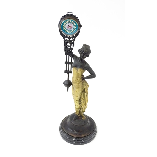 1443 - A Continental Art Nouveau style mystery clock (swing clock), with figural detail. Approx. 11 1/2