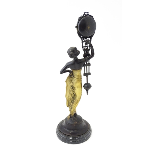 1443 - A Continental Art Nouveau style mystery clock (swing clock), with figural detail. Approx. 11 1/2