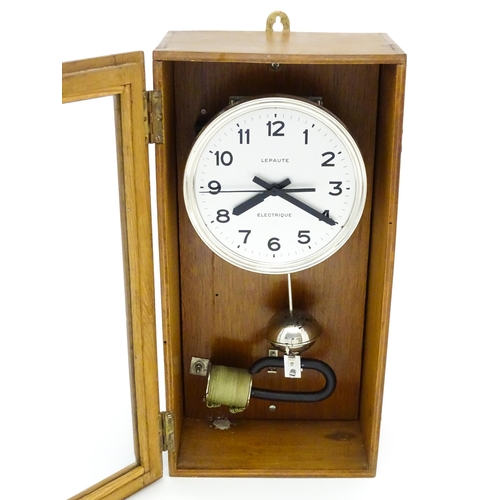 1445 - Lepaute : An early 20thC oak cased electric clock. The white dial with Arabic numerals signed Lepaut... 