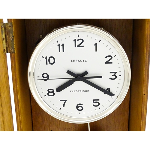 1445 - Lepaute : An early 20thC oak cased electric clock. The white dial with Arabic numerals signed Lepaut... 