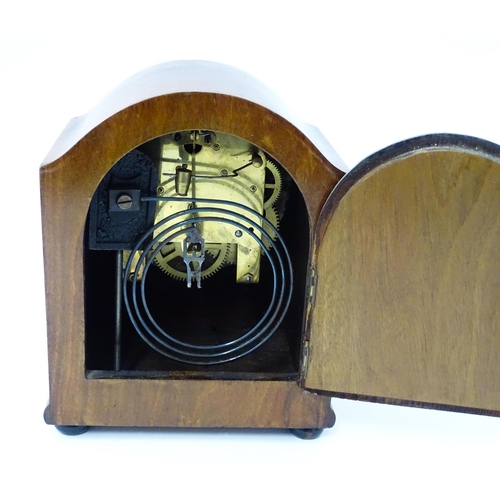 1446 - An early 20thC German walnut cased mantle clock with burr walnut veneered detail and satinwood strin... 