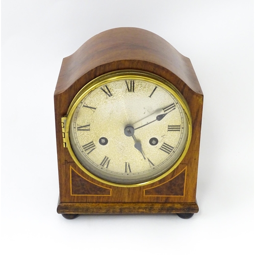 1446 - An early 20thC German walnut cased mantle clock with burr walnut veneered detail and satinwood strin... 