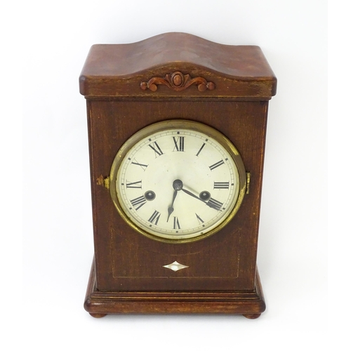 1447 - A mahogany cased mantle clock with silvered dial and Roman numerals. The by Gustav Becker 8-day move... 