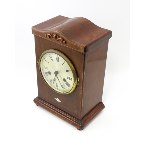 1447 - A mahogany cased mantle clock with silvered dial and Roman numerals. The by Gustav Becker 8-day move... 