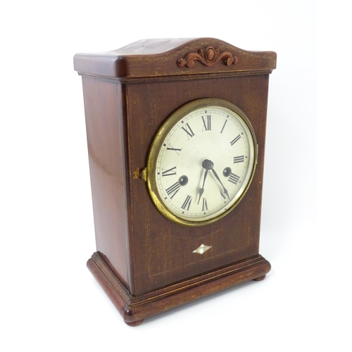 1447 - A mahogany cased mantle clock with silvered dial and Roman numerals. The by Gustav Becker 8-day move... 