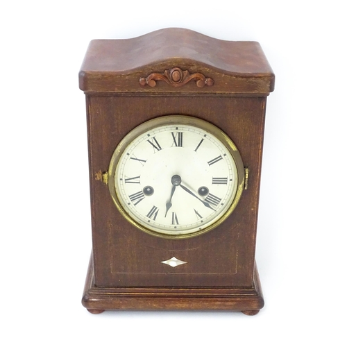 1447 - A mahogany cased mantle clock with silvered dial and Roman numerals. The by Gustav Becker 8-day move... 