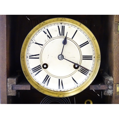 1450 - A late 19th/ early 20thC mahogany cased mantle clock by Philipp Haas & Sohne. The white enamel dial ... 