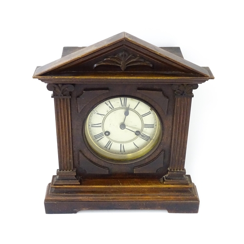 1450 - A late 19th/ early 20thC mahogany cased mantle clock by Philipp Haas & Sohne. The white enamel dial ... 