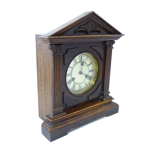 1450 - A late 19th/ early 20thC mahogany cased mantle clock by Philipp Haas & Sohne. The white enamel dial ... 