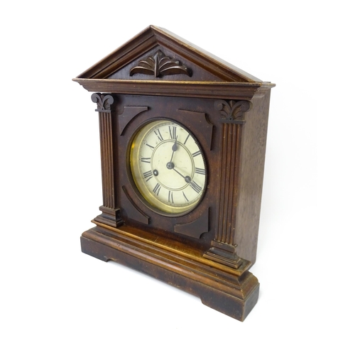 1450 - A late 19th/ early 20thC mahogany cased mantle clock by Philipp Haas & Sohne. The white enamel dial ... 