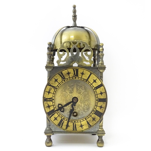 1451 - Smiths - Great Britain : A 20thC brass lantern clock by Smiths with engraved dial and Roman numeral ... 