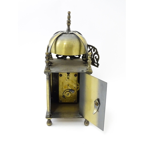 1451 - Smiths - Great Britain : A 20thC brass lantern clock by Smiths with engraved dial and Roman numeral ... 