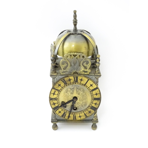 1451 - Smiths - Great Britain : A 20thC brass lantern clock by Smiths with engraved dial and Roman numeral ... 