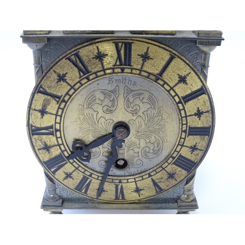 1451 - Smiths - Great Britain : A 20thC brass lantern clock by Smiths with engraved dial and Roman numeral ... 