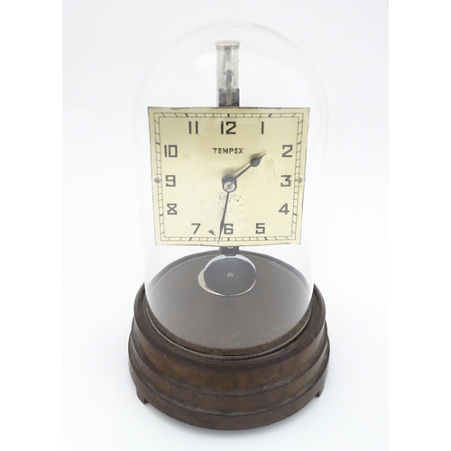 1452 - A Tempex electric clock mounted on a Bakelite base with chrome fitting. The squared dial with Arabic... 