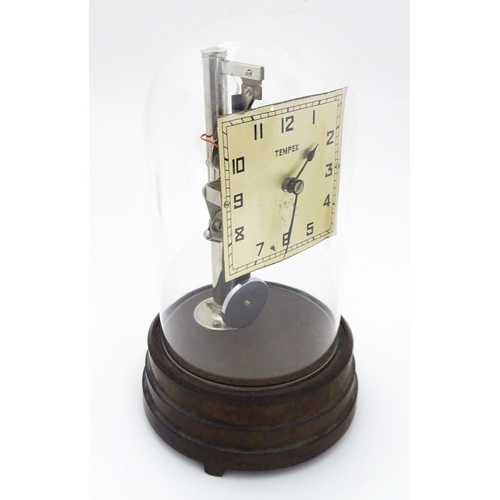 1452 - A Tempex electric clock mounted on a Bakelite base with chrome fitting. The squared dial with Arabic... 