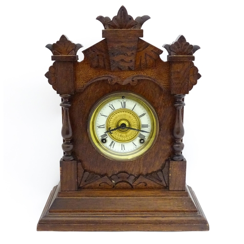 1453 - A Late 19thC / Early 20thC American oak cased mantle clock by the Ansonia Clock Company - New York, ... 