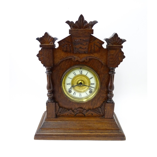 1453 - A Late 19thC / Early 20thC American oak cased mantle clock by the Ansonia Clock Company - New York, ... 