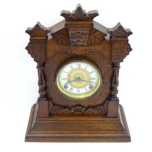 1453 - A Late 19thC / Early 20thC American oak cased mantle clock by the Ansonia Clock Company - New York, ... 