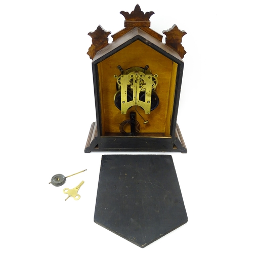 1453 - A Late 19thC / Early 20thC American oak cased mantle clock by the Ansonia Clock Company - New York, ... 