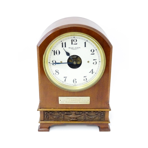 1460 - Bulle - Clock : A French  mahogany cased electric mantel clock by Bulle. Model BC. The case decorate... 