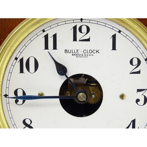 1460 - Bulle - Clock : A French  mahogany cased electric mantel clock by Bulle. Model BC. The case decorate... 