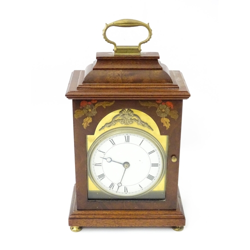 1461 - A 20thC walnut cased mantle clock with inlaid  floral detail and white enamel dial with Roman chapte... 