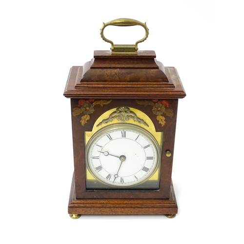 1461 - A 20thC walnut cased mantle clock with inlaid  floral detail and white enamel dial with Roman chapte... 