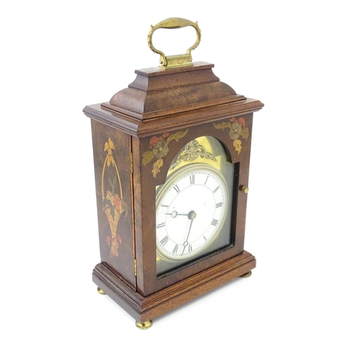 1461 - A 20thC walnut cased mantle clock with inlaid  floral detail and white enamel dial with Roman chapte... 