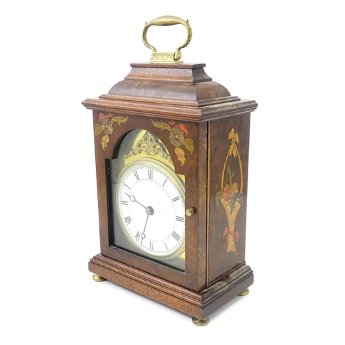 1461 - A 20thC walnut cased mantle clock with inlaid  floral detail and white enamel dial with Roman chapte... 