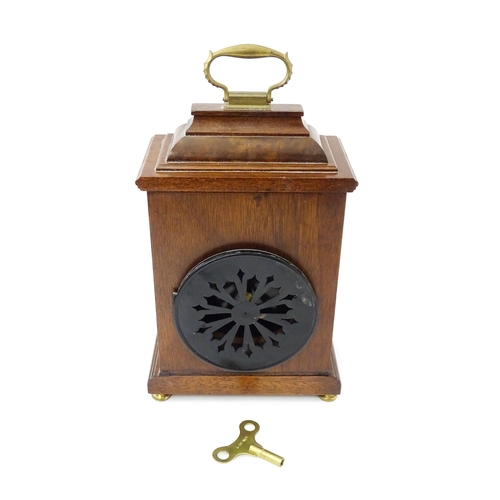 1461 - A 20thC walnut cased mantle clock with inlaid  floral detail and white enamel dial with Roman chapte... 