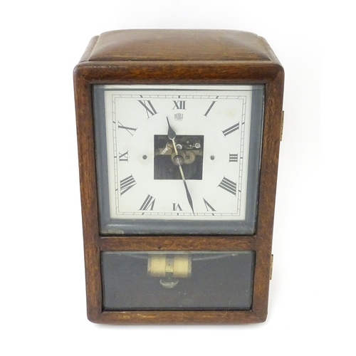 1462 - Bulle : A French Art Deco oak cased electric mantel clock by Bulle. The dial signed Bulle Patent   A... 