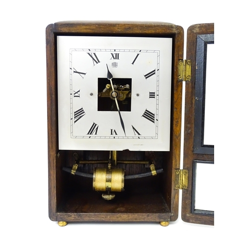 1462 - Bulle : A French Art Deco oak cased electric mantel clock by Bulle. The dial signed Bulle Patent   A... 