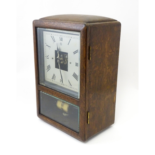 1462 - Bulle : A French Art Deco oak cased electric mantel clock by Bulle. The dial signed Bulle Patent   A... 