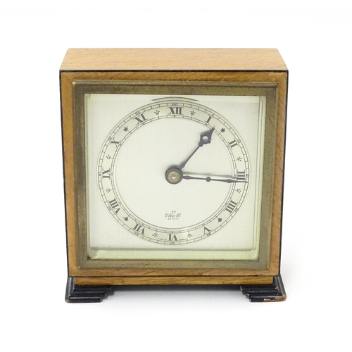 1467 - A 20thC mantle clock by Elliott. the dial with Roman numeral chapter ring and signed ' An Elliott Cl... 