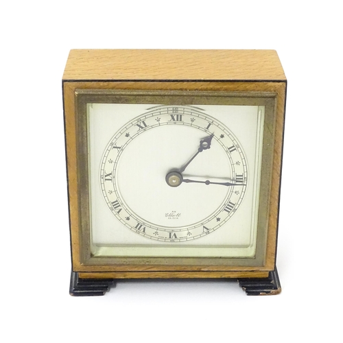 1467 - A 20thC mantle clock by Elliott. the dial with Roman numeral chapter ring and signed ' An Elliott Cl... 