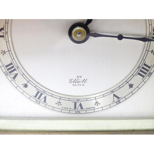 1467 - A 20thC mantle clock by Elliott. the dial with Roman numeral chapter ring and signed ' An Elliott Cl... 