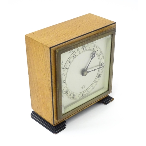 1467 - A 20thC mantle clock by Elliott. the dial with Roman numeral chapter ring and signed ' An Elliott Cl... 