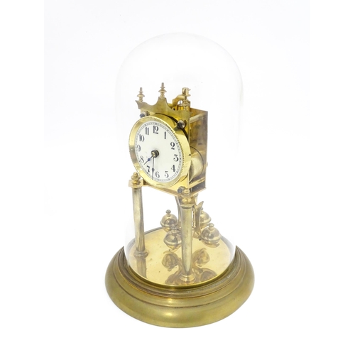 1468 - A 20thC anniversary / table clock with white enamel dial and Roman numerals. Under glass  dome Appro... 