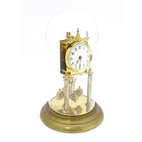 1468 - A 20thC anniversary / table clock with white enamel dial and Roman numerals. Under glass  dome Appro... 