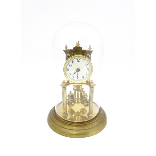 1468 - A 20thC anniversary / table clock with white enamel dial and Roman numerals. Under glass  dome Appro... 