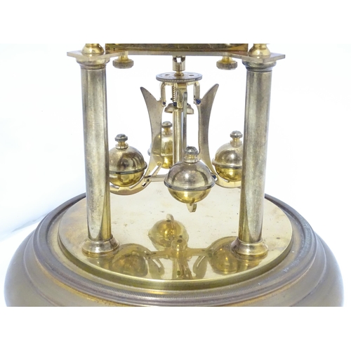 1468 - A 20thC anniversary / table clock with white enamel dial and Roman numerals. Under glass  dome Appro... 