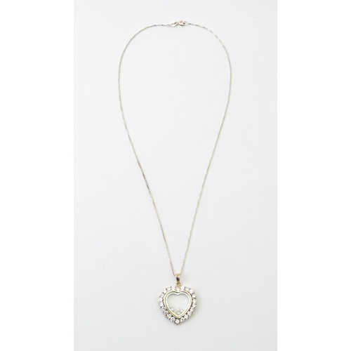 732A - A silver chain with heart shaped locket pendant set with white stones with further white stones with... 