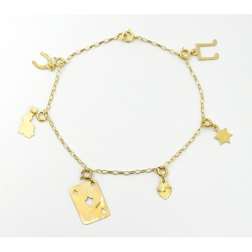 736A - A 9ct gold bracelet set with various charms to include horse shoe, ace of spades, rabbit, etc. Appro... 