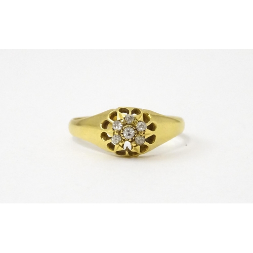 745A - An 18ct gold ring set with 6 diamonds. Ring size approx L