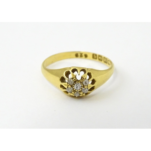 745A - An 18ct gold ring set with 6 diamonds. Ring size approx L