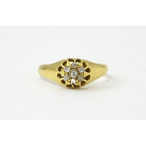 745A - An 18ct gold ring set with 6 diamonds. Ring size approx L