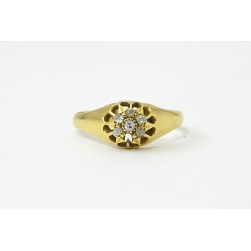 745A - An 18ct gold ring set with 6 diamonds. Ring size approx L